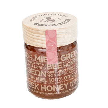 Premium Greek Raw Blossom Honey – Pure, Natural, and Unfiltered Jar Close-up of a jar of Premium Greek Raw Blossom Honey showcasing the rich, golden color and smooth texture.