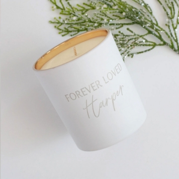 Celebrate Special Occasions – Forever Loved Custom Candle The Forever Loved Custom Engraved Candle placed on a mantel, radiating comforting vanilla and woody undertones for weddings or anniversaries.