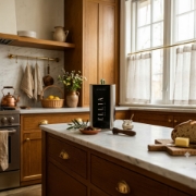 ELL1A 3L Wild Olive Oil tin in a luxury rustic kitchen setting on a marble countertop, positioned as a high-end Mediterranean gourmet ingredient and artisanal gift.