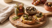 Escargot de Crete Snail Fillets in Cretan Olive Oil, Vinegar & Rosemary - 90g Jar on a clean ecommerce background